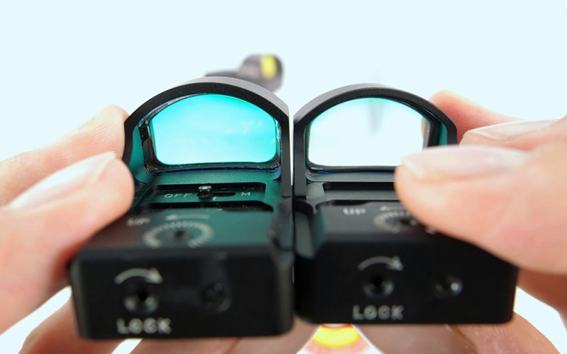 close-up photo of two sight scopes being compared